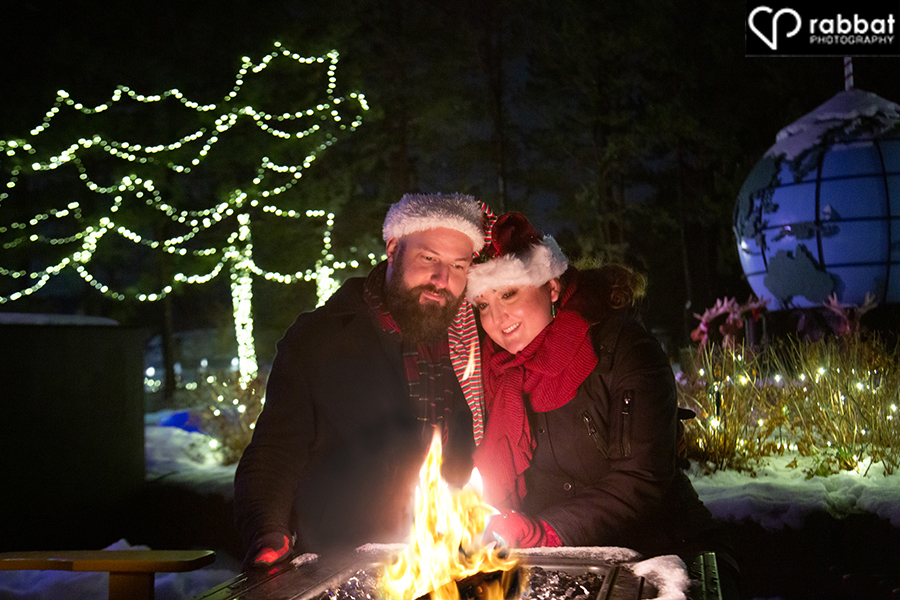 Romantic engagement photo in front of the fire at Canada's Wonderland Winterfest