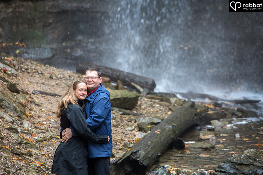 Happy couple in front of waterfalls