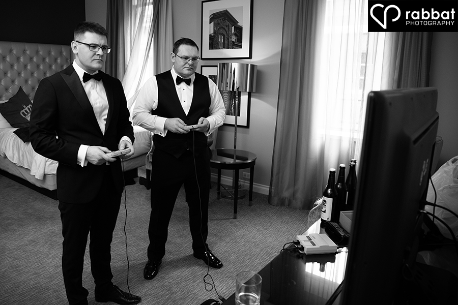 Groom and best man playing video games