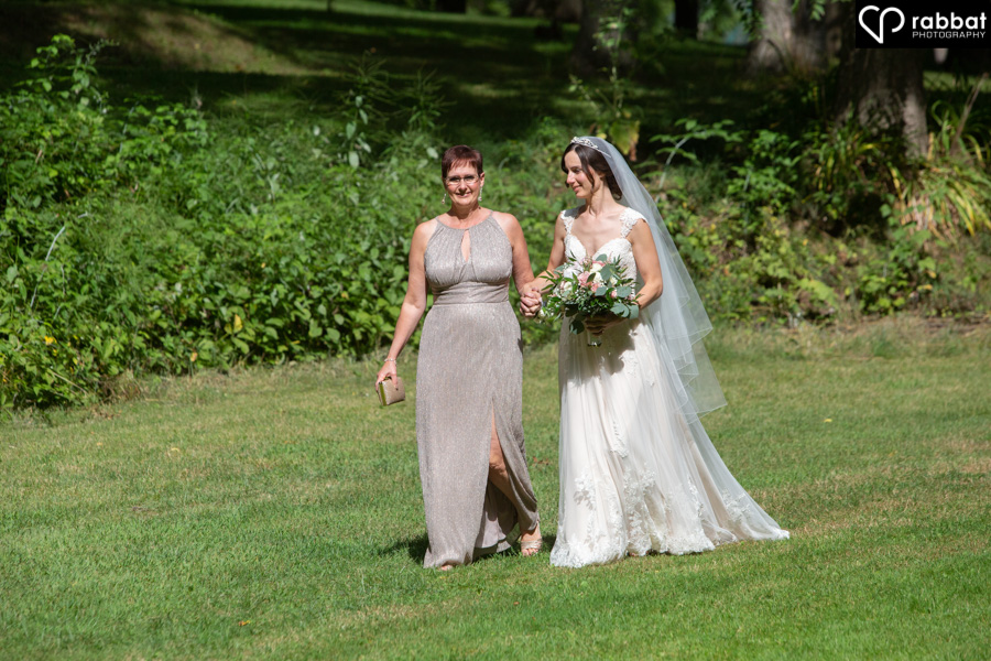 Mom and daughter walking down the aisle