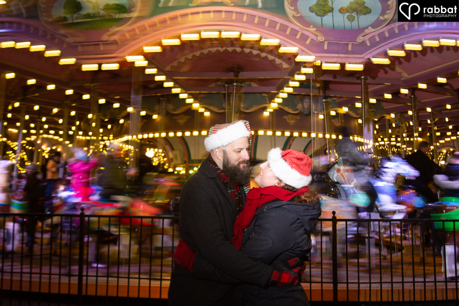 Engagement photos in front of a carousel