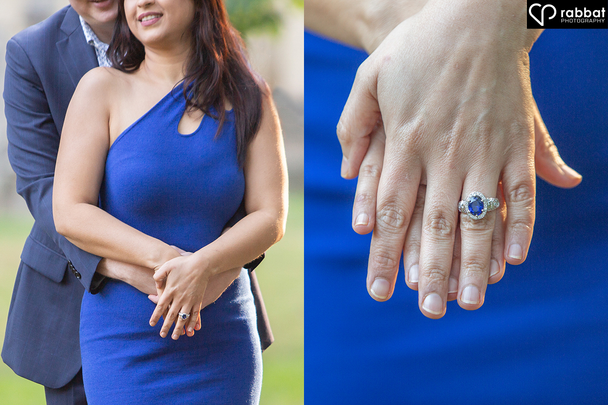 This couple is hugging, but you can only see from just below the waist to the tops of their noses. A beautiful south Asian woman is in front with her hands crossed over her waist, on top of her fiance's hands. In the photo on the right, two hands are on top of a blue dress and the one on top features a stunning blue engagement ring.