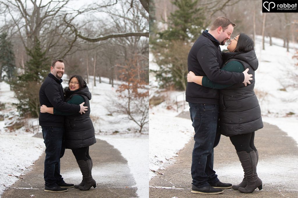 Two vertical photos side by side of a young couple dressed in black outside on a snowy path. They are hugging and looking at the camera in the first photo and they are kissing in the second photo.