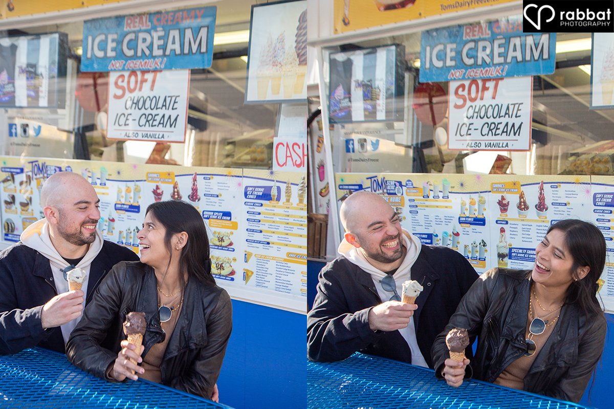 Two side by side vertical photos of a couple eating ice cream in front of Tom's Dairy Freeze, outdoor ice cream place. They are looking at each other in the photo on the left. She has a giant chocolate ice cream cone and he has a vanilla cone. they are both laughing.They are sitting on a blue bench in front of the ice cream store, which has the menu and photos of ice cream on it. Man is white, woman is South Asian.